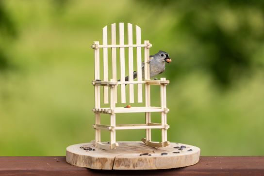 Miniature Puzzle Rocker with songbird perched on back — handcrafted Tennessee hickory