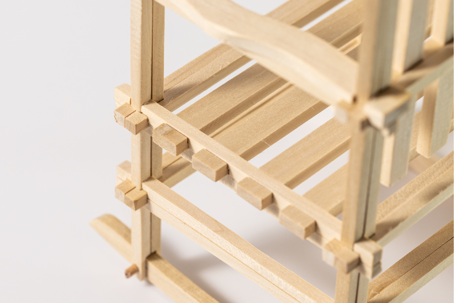 Close up of interlocking hickory wood joinery on Puzzle Rocker