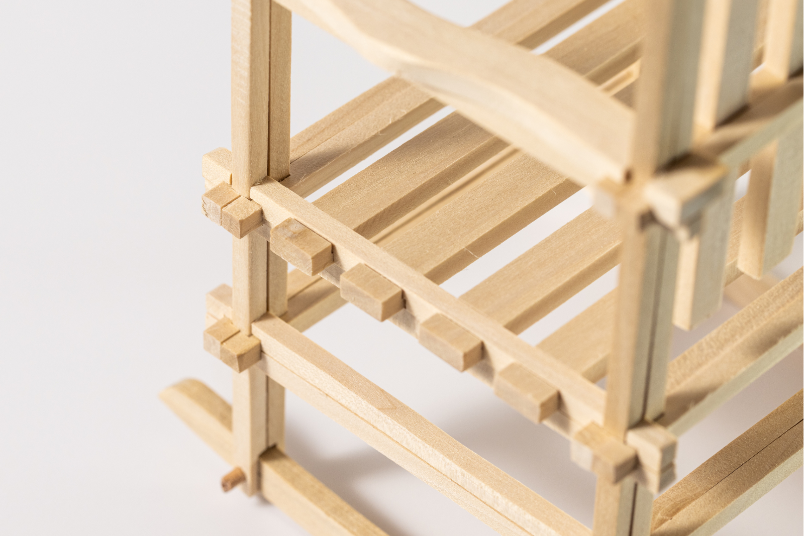 Close up of interlocking hickory wood joinery on Puzzle Rocker